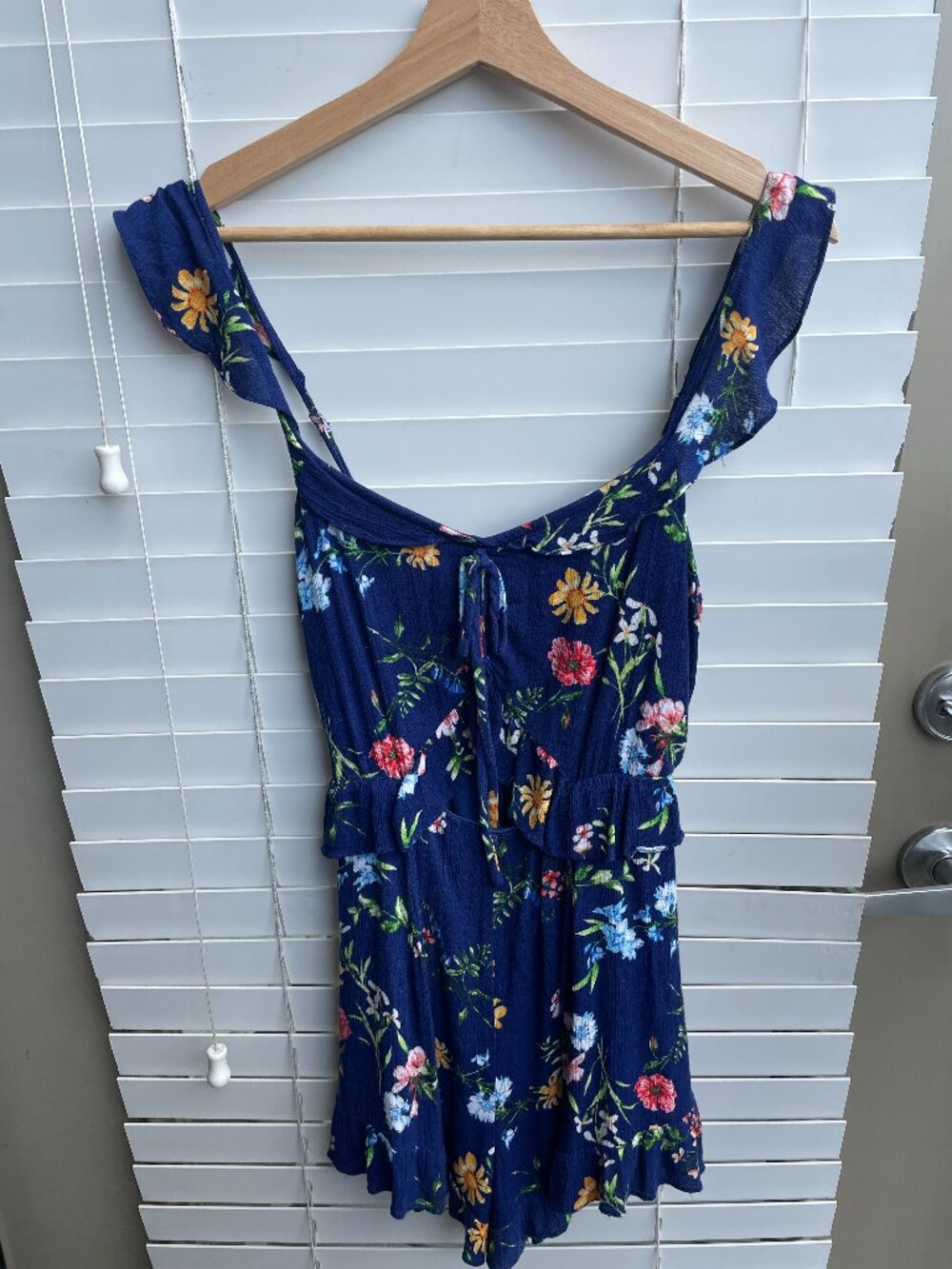 Lulus blue floral ruffle romper with sweetheart neckline